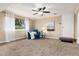 Cozy living room with natural light, comfortable seating, and a door leading to the outside at 7676 S Olive Cir, Centennial, CO 80112