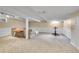 Finished basement with ample space for recreation, a comfortable seating area, and exercise equipment at 4782 E Costilla Ave, Centennial, CO 80122