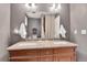 Bathroom with double sink vanity, granite countertops, and neutral decor at 4782 E Costilla Ave, Centennial, CO 80122