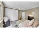 Relaxing bedroom features neutral color scheme, storage, closet, and natural light at 4782 E Costilla Ave, Centennial, CO 80122