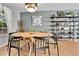 Well-lit dining room with a round table and modern decor at 4782 E Costilla Ave, Centennial, CO 80122