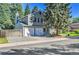 Two-story gray home with a two-car garage and mature trees at 4782 E Costilla Ave, Centennial, CO 80122