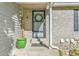 Welcoming front entrance with a decorative wreath and a lush green potted plant at 4782 E Costilla Ave, Centennial, CO 80122