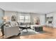 Inviting living room featuring a sectional sofa and built-in storage at 4782 E Costilla Ave, Centennial, CO 80122