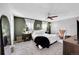Spacious main bedroom features a ceiling fan, two windows with curtains, and neutral décor at 4782 E Costilla Ave, Centennial, CO 80122
