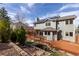 Backyard with deck, pond, patio, and solar panels at 11932 W 56Th Cir, Arvada, CO 80002