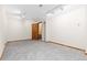 Basement featuring neutral carpet and an open door with a view of the stairs at 11932 W 56Th Cir, Arvada, CO 80002