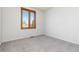 Bedroom featuring neutral carpet and window offering outside views at 11932 W 56Th Cir, Arvada, CO 80002