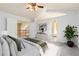 Spacious bedroom with a vaulted ceiling, large windows, and a view of the open landing at 11932 W 56Th Cir, Arvada, CO 80002