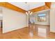 Traditional dining room featuring hardwood floors, wooden beam ceiling accents and a large window at 11932 W 56Th Cir, Arvada, CO 80002