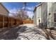 Side of house with driveway and gated entrance at 11932 W 56Th Cir, Arvada, CO 80002