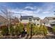 Back of house with deck, solar panels, and mature trees at 11932 W 56Th Cir, Arvada, CO 80002