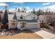 Exterior shot of a home with an attached garage and a front porch at 11932 W 56Th Cir, Arvada, CO 80002