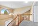 Bright hallway showcasing a large, arched window at 11932 W 56Th Cir, Arvada, CO 80002