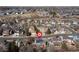 Aerial view of neighborhood featuring a two-story home with solar panels at 11932 W 56Th Cir, Arvada, CO 80002