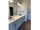 Bathroom featuring dual sinks, modern fixtures, and a clean, bright design at 191 Washington St, Erie, CO 80516