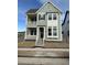 Charming two-story home featuring a double porch and stylish exterior accents at 191 Washington St, Erie, CO 80516