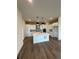 Modern kitchen with stainless steel appliances, pendant lighting, and a central island at 191 Washington St, Erie, CO 80516