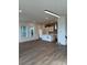 Spacious living room featuring wood floors that seamlessly transitions to the modern kitchen at 191 Washington St, Erie, CO 80516