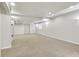 Spacious carpeted basement featuring recessed lighting and a window for natural light at 51 Falcon Hills Dr, Highlands Ranch, CO 80126