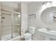 A neutral bathroom features a tile shower, ceramic tile flooring, and a pedestal sink at 51 Falcon Hills Dr, Highlands Ranch, CO 80126