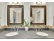 A bright bathroom features double sinks, granite countertop, and decorative mirrors at 51 Falcon Hills Dr, Highlands Ranch, CO 80126