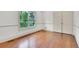 Bedroom with hardwood floors, double closets and natural light from the backyard at 51 Falcon Hills Dr, Highlands Ranch, CO 80126