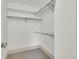 A small closet with shelving and a hanging rod at 51 Falcon Hills Dr, Highlands Ranch, CO 80126