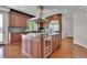 Gourmet kitchen featuring dark wood cabinetry, stainless steel appliances, and a spacious center island at 51 Falcon Hills Dr, Highlands Ranch, CO 80126