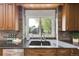Well-appointed kitchen with granite countertops, stainless steel appliances, and stylish backsplash at 51 Falcon Hills Dr, Highlands Ranch, CO 80126