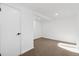 Bright, spacious basement bedroom with neutral carpeting and ample natural light at 4441 E Montana Pl, Denver, CO 80222