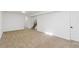 Finished basement area with neutral carpeting and ample space at 4441 E Montana Pl, Denver, CO 80222