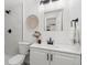 Updated bathroom with a walk-in shower and white cabinetry at 4441 E Montana Pl, Denver, CO 80222