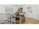 Dining area with wooden table and gray chairs near the kitchen at 4441 E Montana Pl, Denver, CO 80222