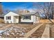 Charming ranch home with updated exterior and a spacious driveway at 4441 E Montana Pl, Denver, CO 80222