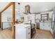 Modern kitchen with white cabinets, quartz countertops, and an island at 4441 E Montana Pl, Denver, CO 80222