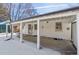 Covered patio with white brick exterior and snow on the ground at 4441 E Montana Pl, Denver, CO 80222