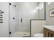 Bathroom featuring a tiled walk-in shower with glass enclosure at 4125 Tejon St, Denver, CO 80211