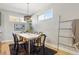 Bright dining room features modern light fixtures and a stylish dining table at 4125 Tejon St, Denver, CO 80211