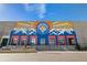 Exterior of Denver Beer Co. featuring colorful mountain mural at 4125 Tejon St, Denver, CO 80211
