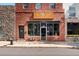 Commercial building with large windows, brick facade, and storefront entrance at 4125 Tejon St, Denver, CO 80211