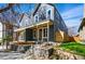 Inviting two-story home with a covered front porch and professionally landscaped yard at 4125 Tejon St, Denver, CO 80211