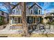 Charming two-story home with a covered front porch and professionally landscaped yard at 4125 Tejon St, Denver, CO 80211