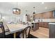 Open-concept dining room featuring seamless flow to the updated kitchen and living area at 4125 Tejon St, Denver, CO 80211