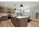 Bright and airy kitchen featuring a large island with sink, modern appliances, and an adjacent dining area at 4125 Tejon St, Denver, CO 80211