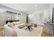 Open-concept living room featuring modern furnishings, hardwood floors, and natural light at 4125 Tejon St, Denver, CO 80211