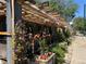Charming outdoor patio with trellis, flowers, and lush greenery, perfect for dining at 4125 Tejon St, Denver, CO 80211