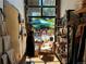Boutique interior featuring curated apparel, decorative shelves, and a courtyard view at 4125 Tejon St, Denver, CO 80211