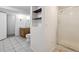 Modern bathroom with built-in shelves, vanity, and a glass-enclosed shower, blending style with functionality at 5800 W Warren Ave, Denver, CO 80227