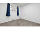 Bright, empty bedroom with vinyl floors, large window, and a neutral color scheme at 5800 W Warren Ave, Denver, CO 80227